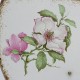 Plaque funéraire en pierre de lave couleur blanche et tour marron avec fleurs
